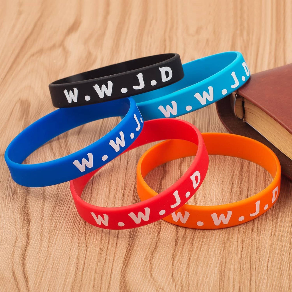 Colorful silicone wristbands in blue, red, and orange with white lettering