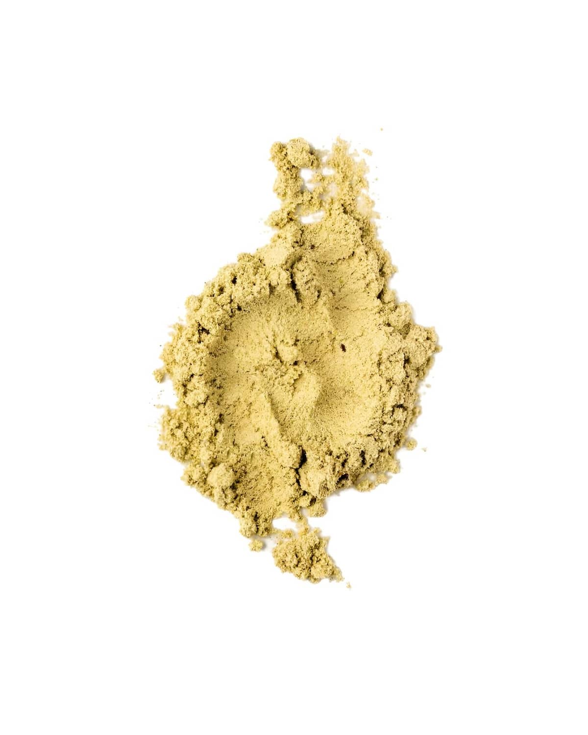 Loose yellow-green detox powder pile of fine granules