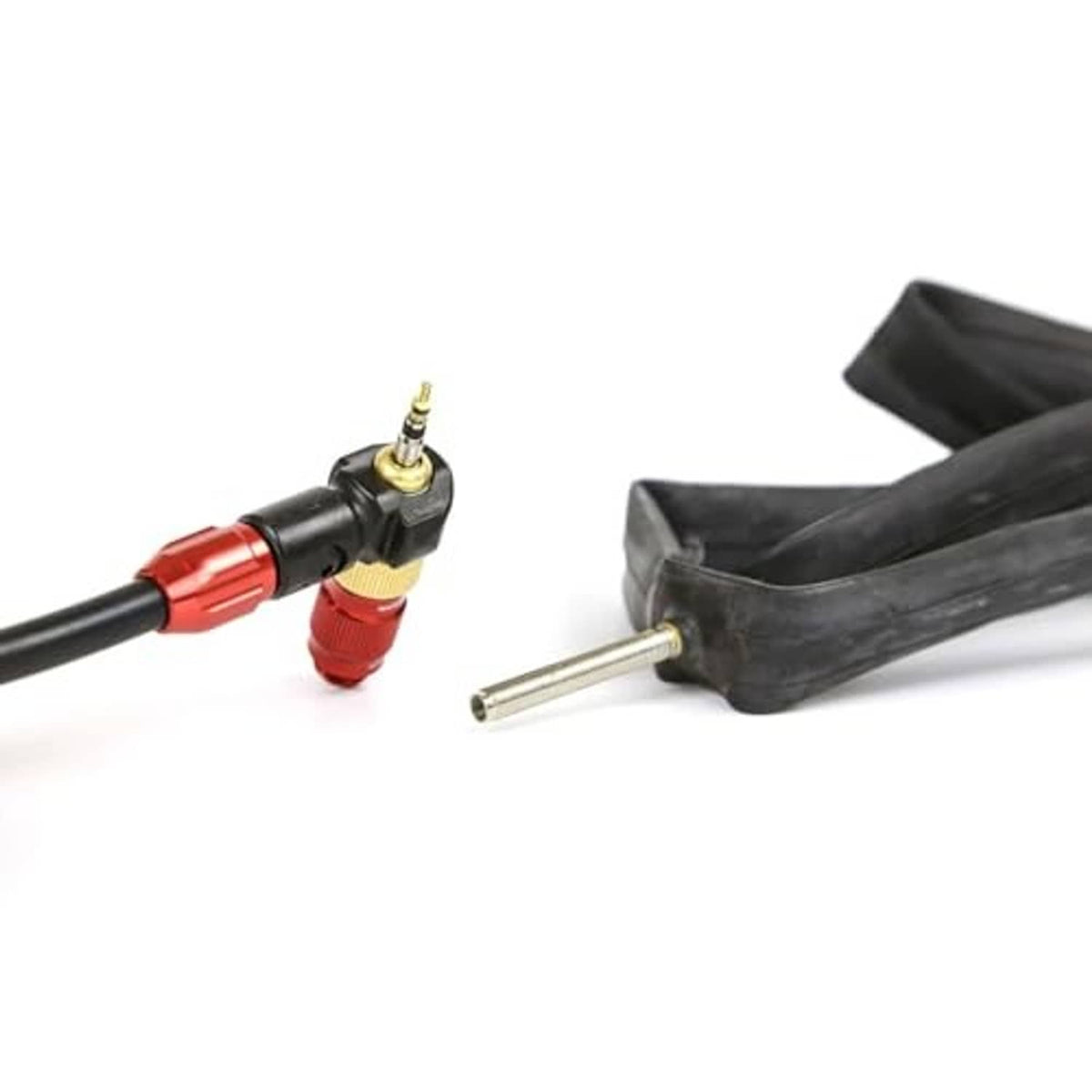 Red-and-black bicycle valve chuck connected to a tire inner tube and stem