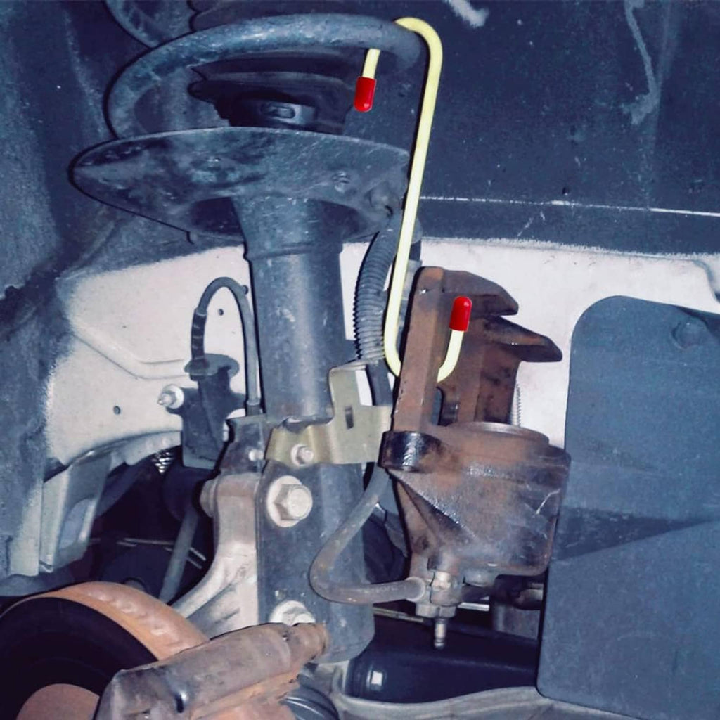 Brake caliper hanger hook in use on a vehicle brake assembly