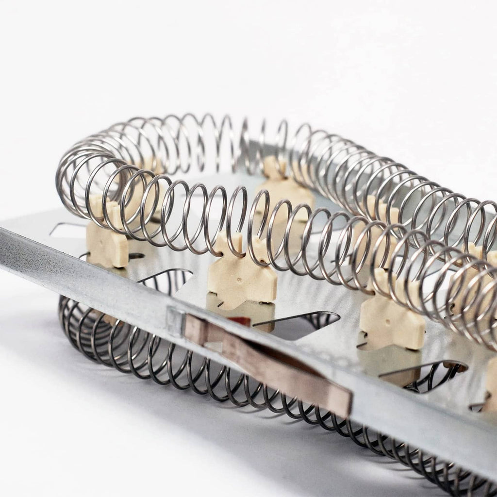 Dryer heating element with chrome coiled springs and beige terminal blocks on metal frame