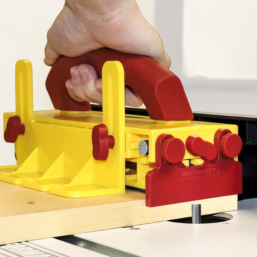 Milescraft push block with yellow base and maroon handle, adjustable red fingers