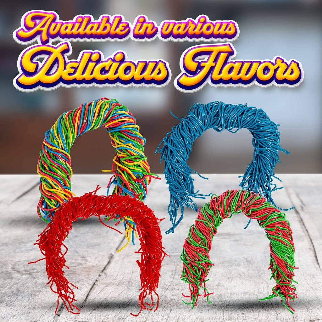 Rainbow and blue string licorice candy shaped as looped letters