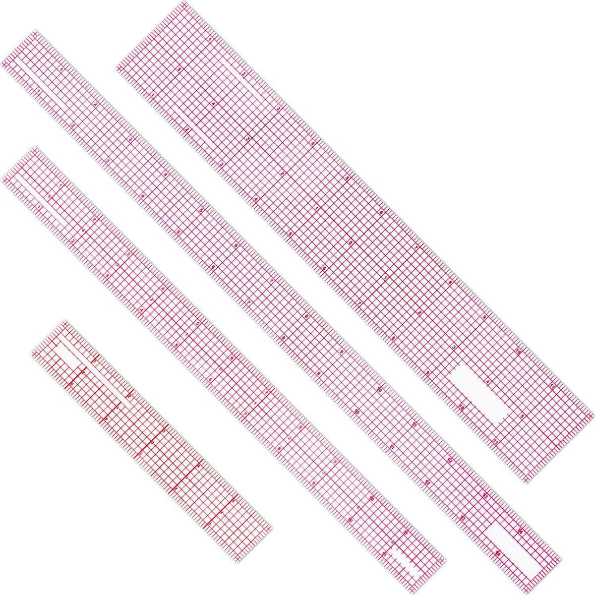 Clear plastic grid ruler set with red measurement markings, four pieces laid out