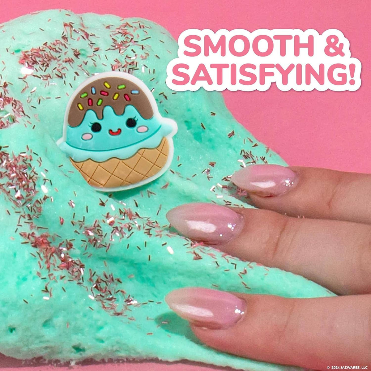 Teal cloud slime with ice-cream charm on top, hand stretching glossy slime