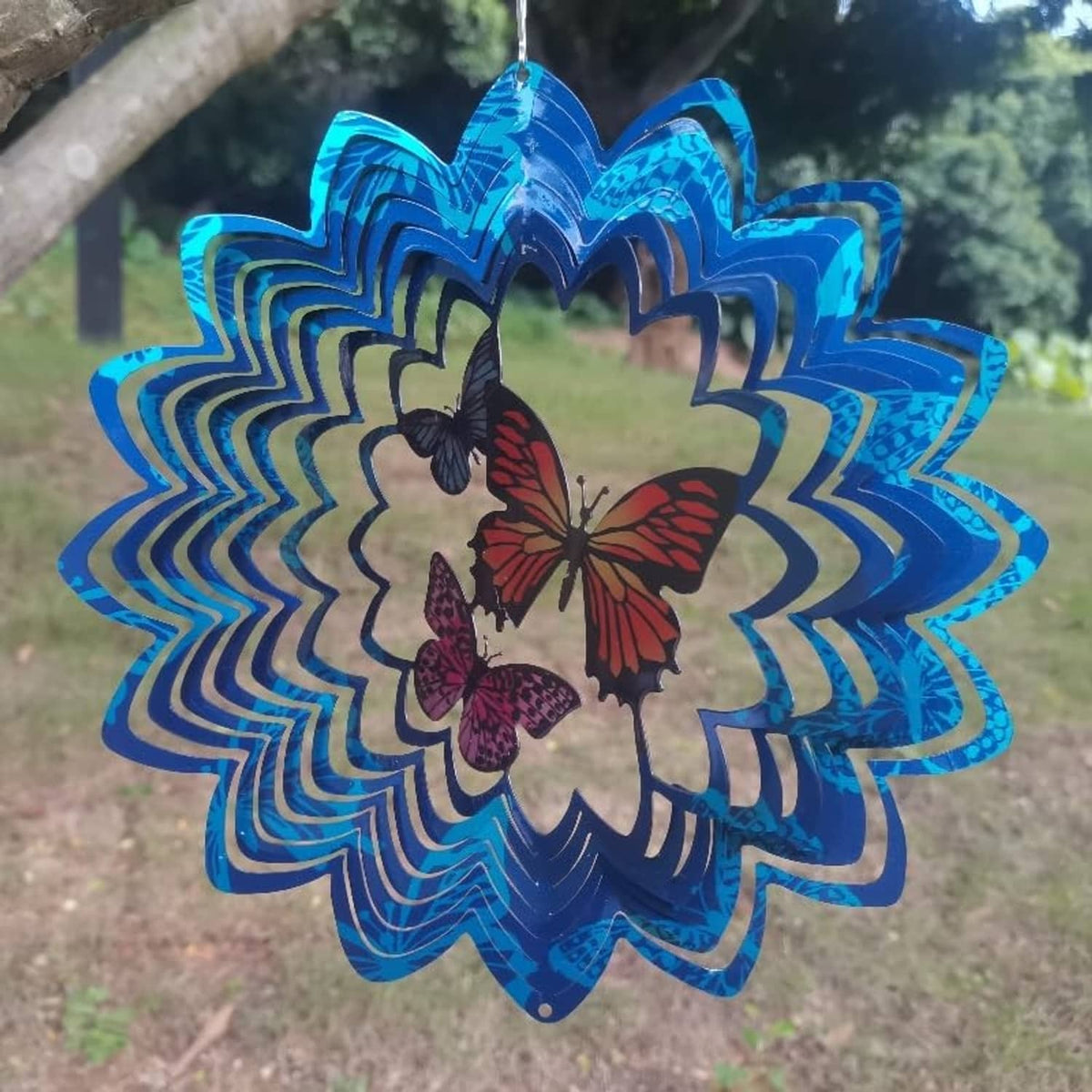 Blue metal butterfly wind spinner with layered flower petals and top hanging chain