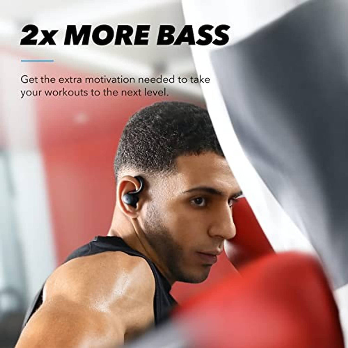 Black true wireless sport earbuds worn in-ear with ear hook during workout.