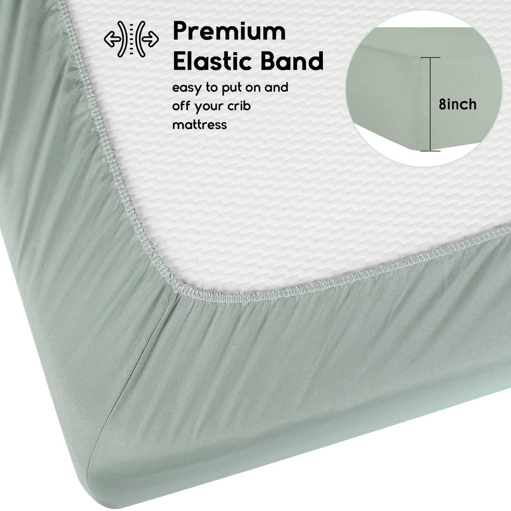 Fitted crib sheet edge with textured fabric and elastic hem; light green and white