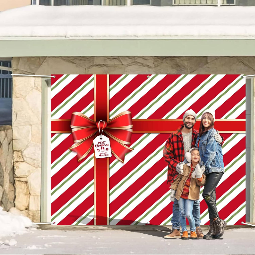 Red and green striped garage door cover with bow and hanging tag on door