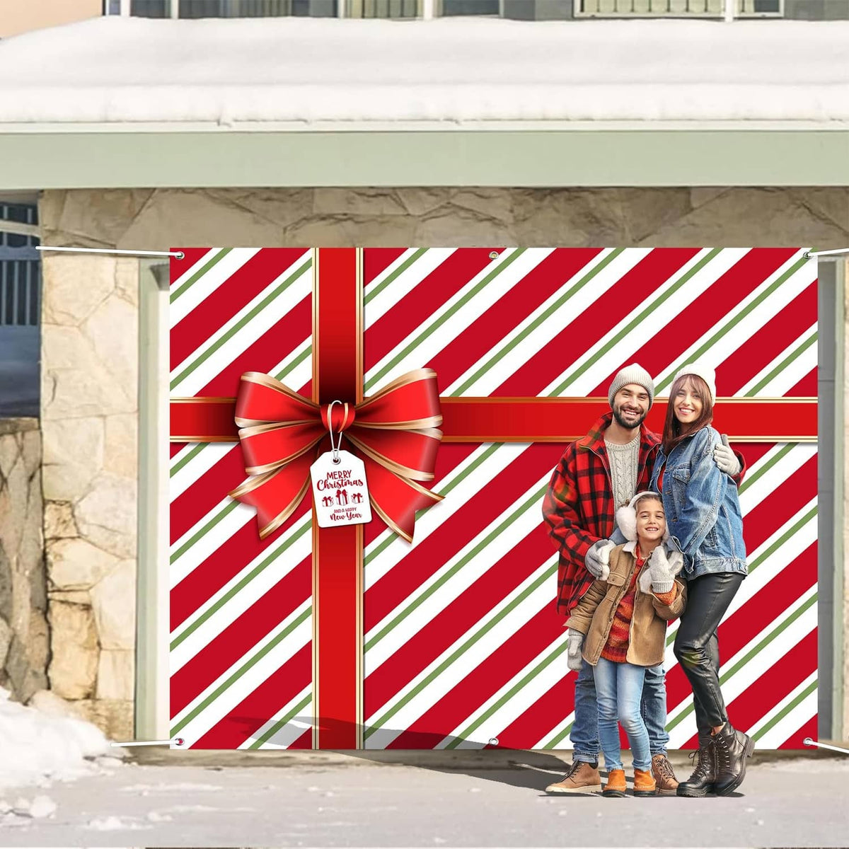 Red and green striped garage door cover with bow and hanging tag on door