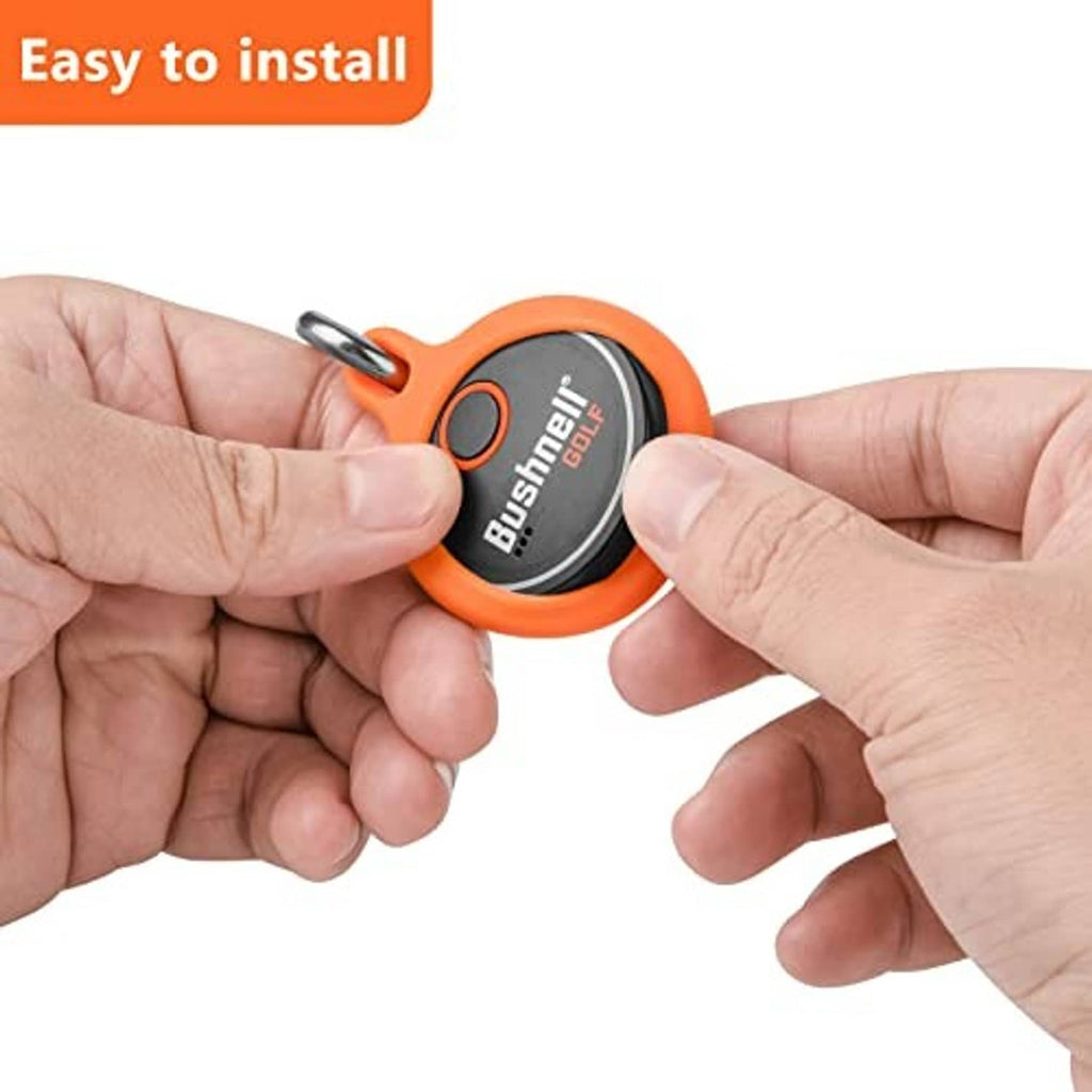 Orange silicone protective key fob case with clip, held between two hands