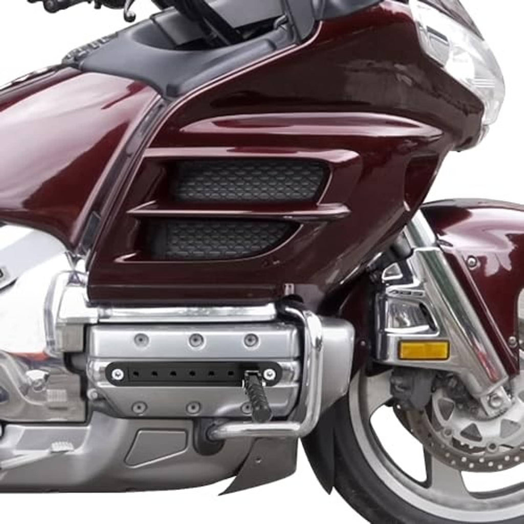 Installed highway peg mount on motorcycle with perforated black bar