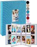 Blue mini vertical photo album with fabric cover; open accordion shows multiple picture inserts