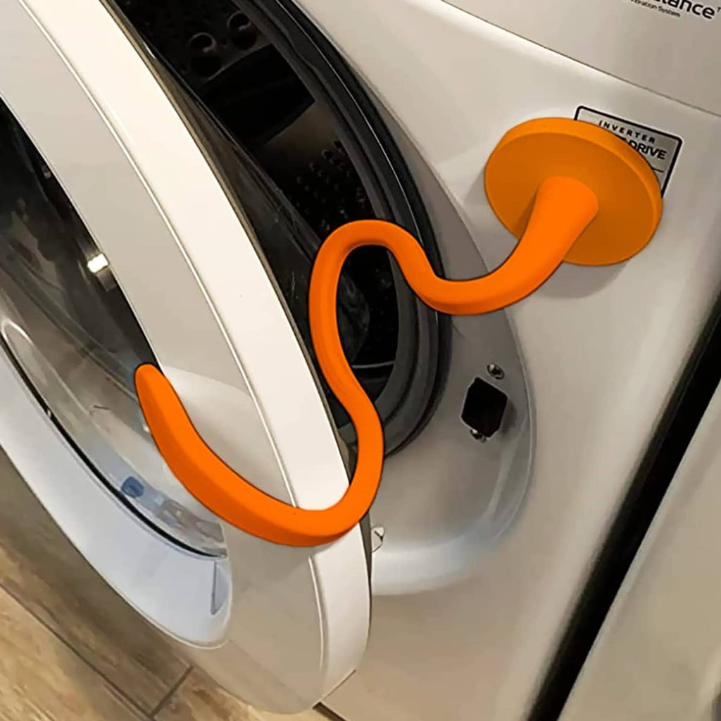 Orange front-load washer door prop, U-shaped stopper attached to door rim