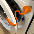 Orange front-load washer door prop, U-shaped stopper attached to door rim