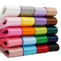 Double-faced satin ribbon rolls, 1-inch, assorted colors stacked in rolls