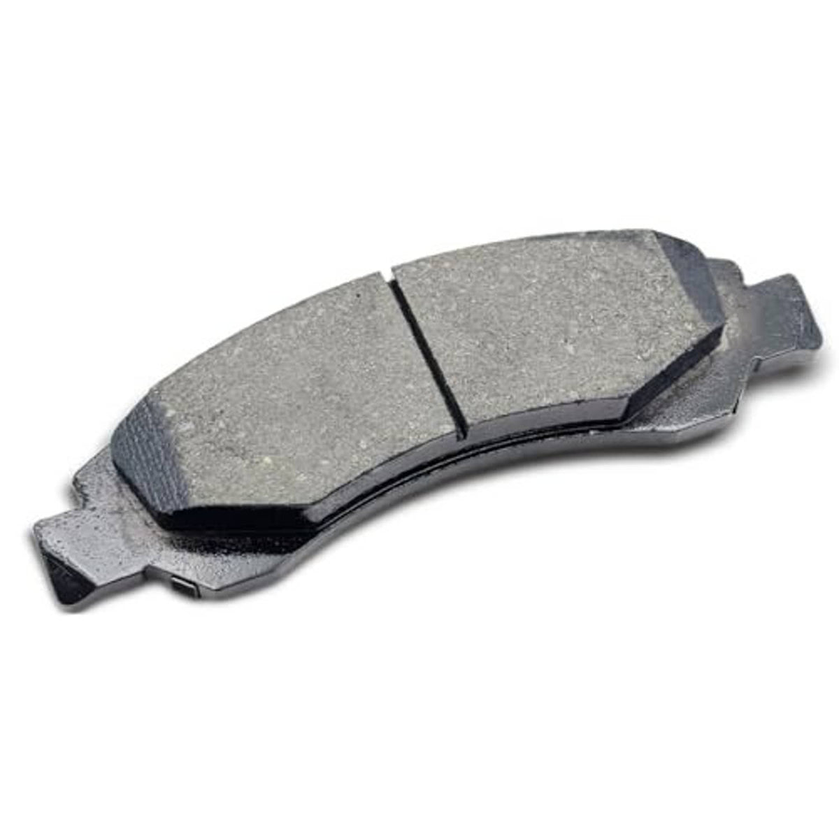 Ceramic brake pad with gray friction material and metal backing, side angle view
