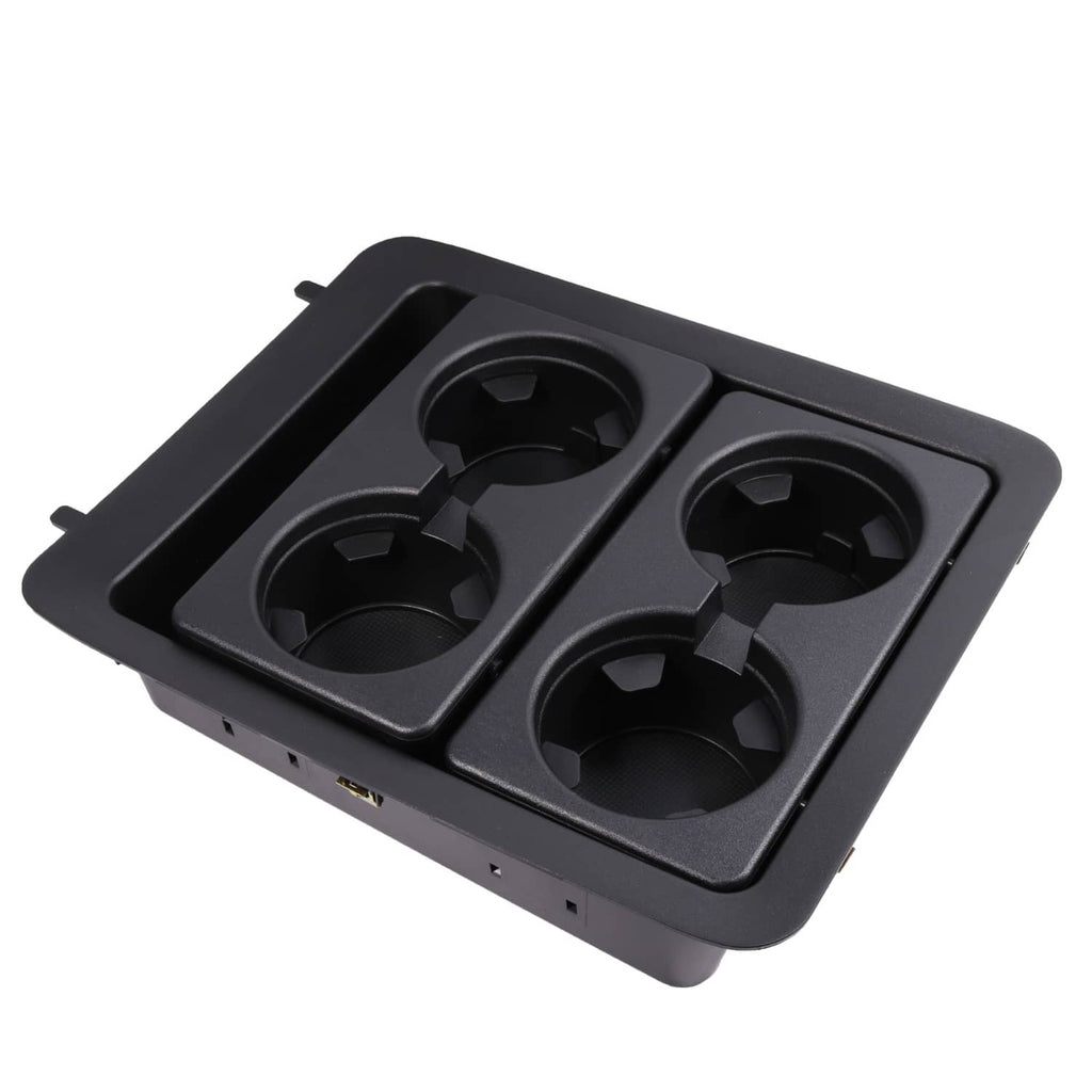 Black plastic center console cup holder bezel with four round cup openings
