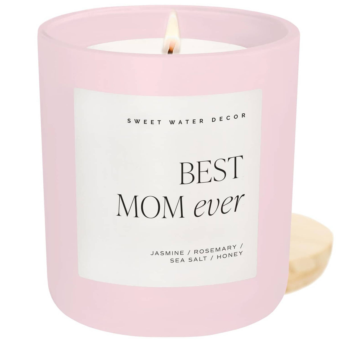 Pink soy jar scented candle with “Best Mom ever” label and unlit wick
