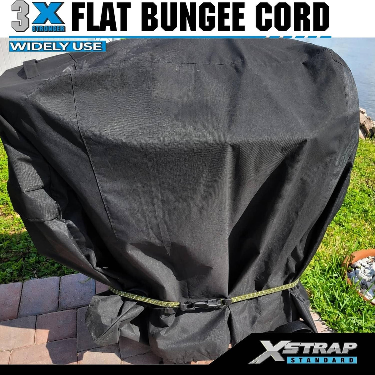 Army green flat bungee cords with black hooks securing a black cover outdoors