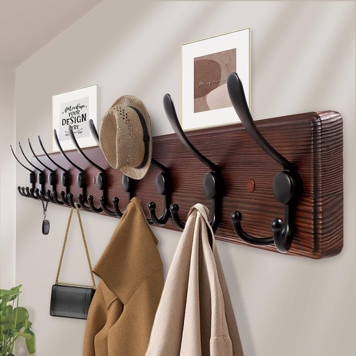 Wall-mounted coat rack with 10 black hooks on dark wood board in entry space
