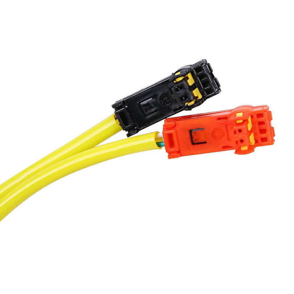 Clock spring wiring end with orange connector and black plug on yellow cables