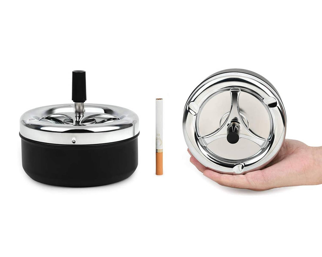 Black ashtray with chrome spinning tray lid, upright holder, and hand opening view