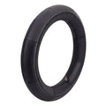 Black motorcycle inner tube with visible brass air valve stem