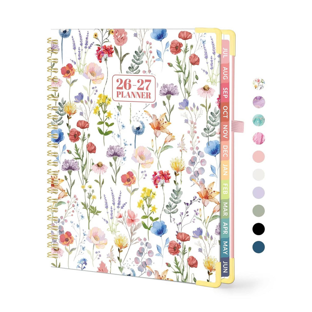Floral spiral-bound academic planner cover with gold ring binding and colorful flowers.