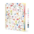 Floral spiral-bound academic planner cover with gold ring binding and colorful flowers.