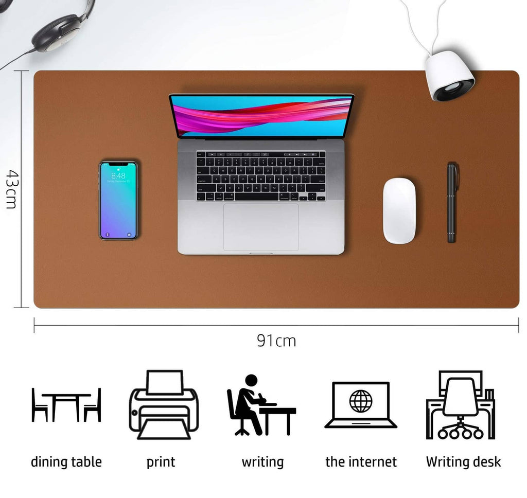 Brown leather desk pad with laptop, phone, mouse, and pen; size marked 91cm x 43cm.