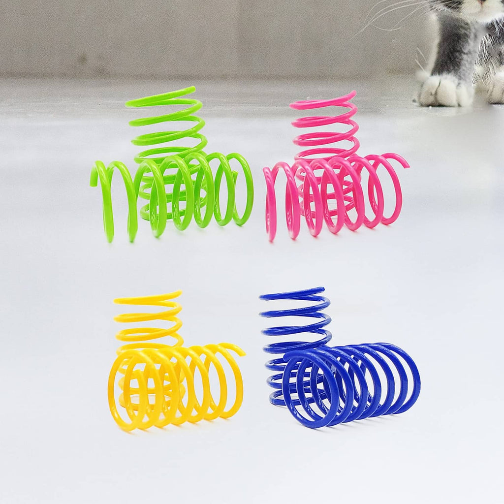 Colorful plastic coiled cat springs in neon green, pink, yellow, and blue