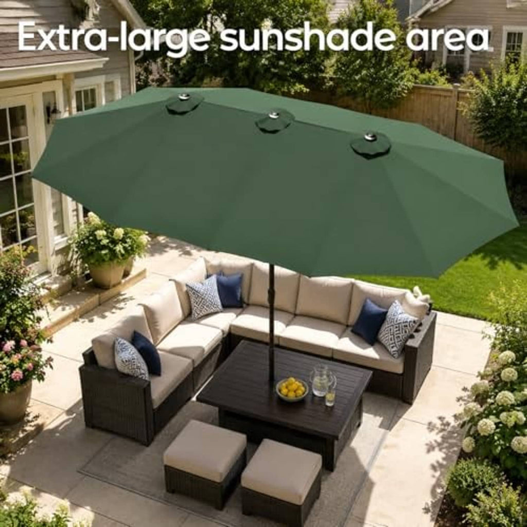 Large dark green patio umbrella over outdoor seating on a tiled patio