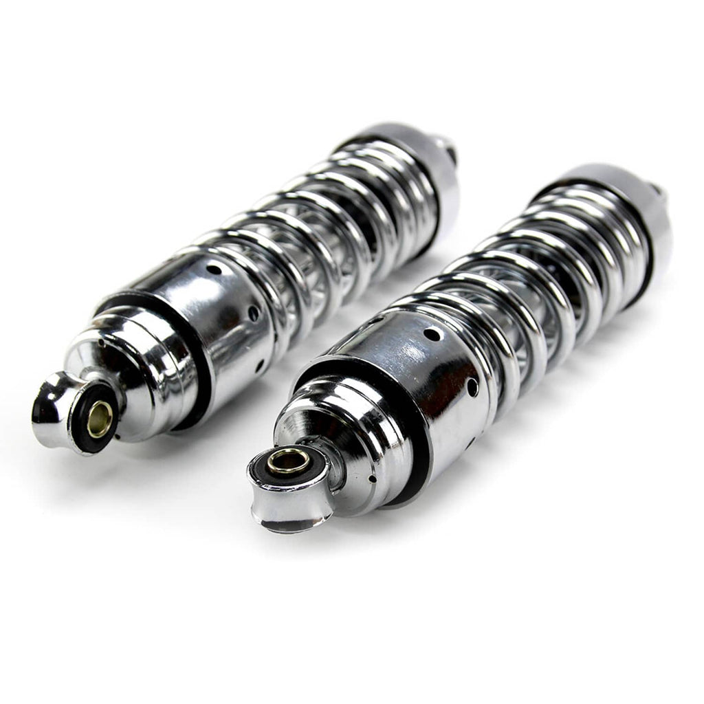 Close-up view of two chrome rear shocks with black coil springs and lower mounts