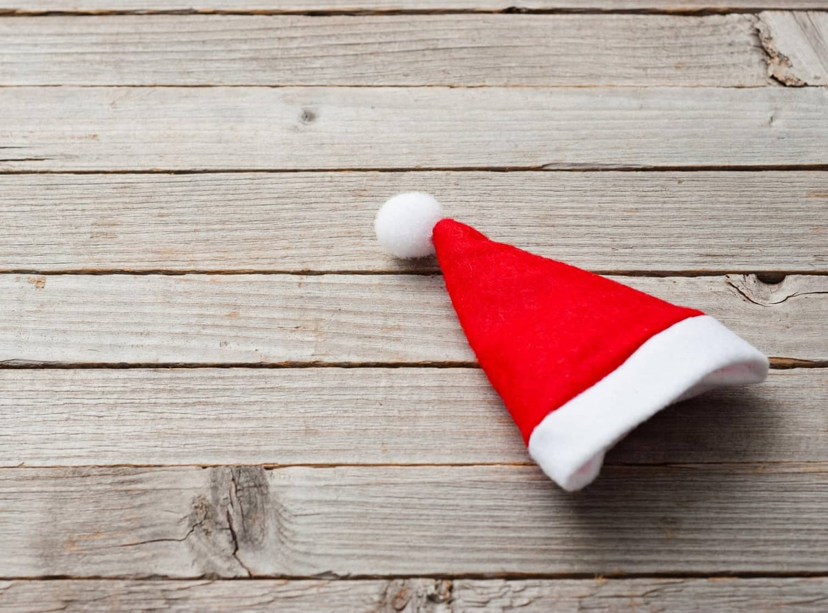 Red felt mini Santa hat with white brim and pom-pom