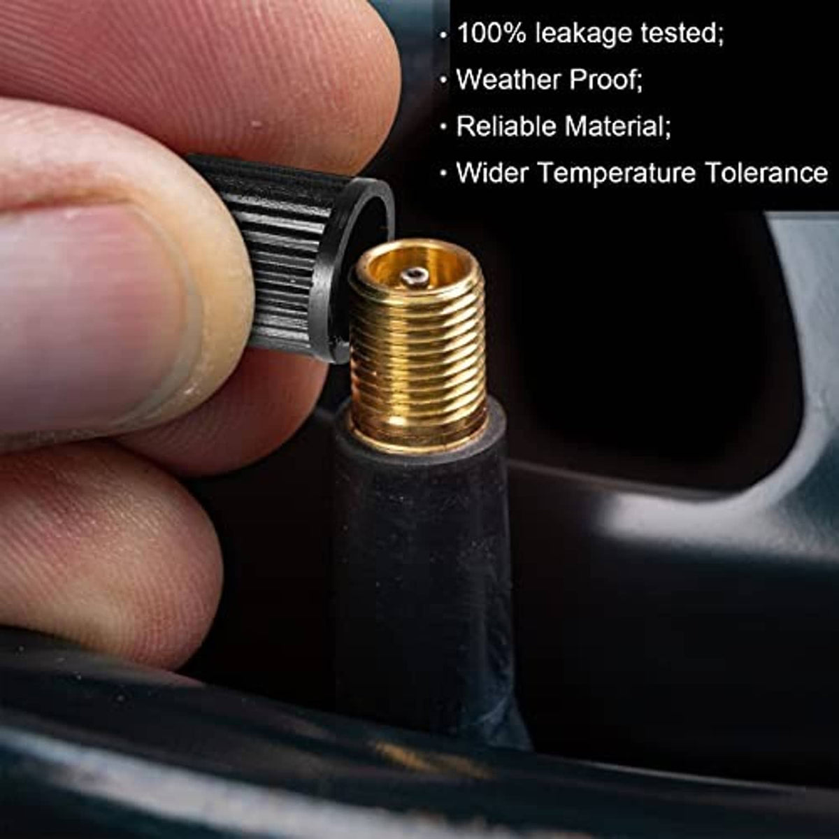 Close-up of black tubeless valve stem with gold threaded core for tire