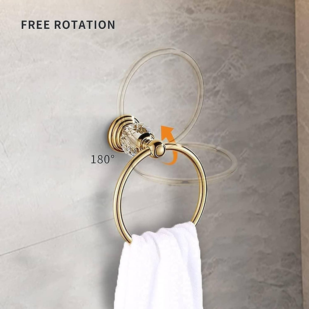 Gold towel ring with faceted crystal mount and white towel, showing free rotation