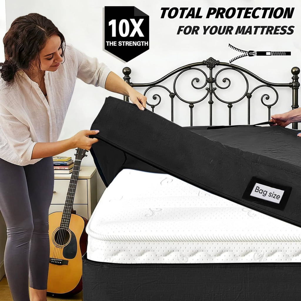 Black mattress storage bag with zipper opening and carry strap on a mattress