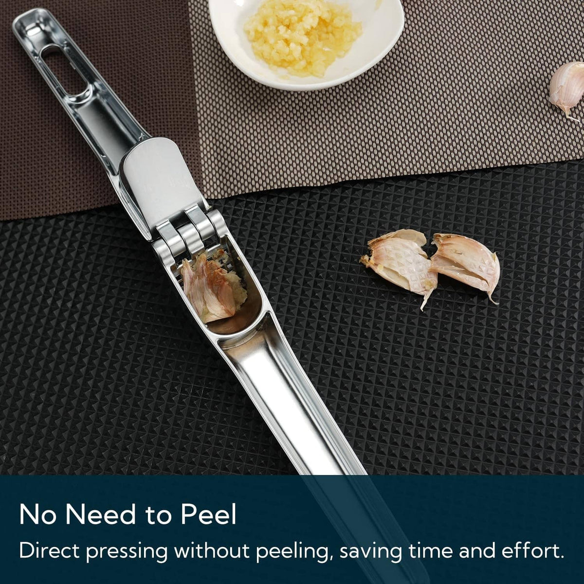 Garlic press for direct crushing without peeling, stainless steel body