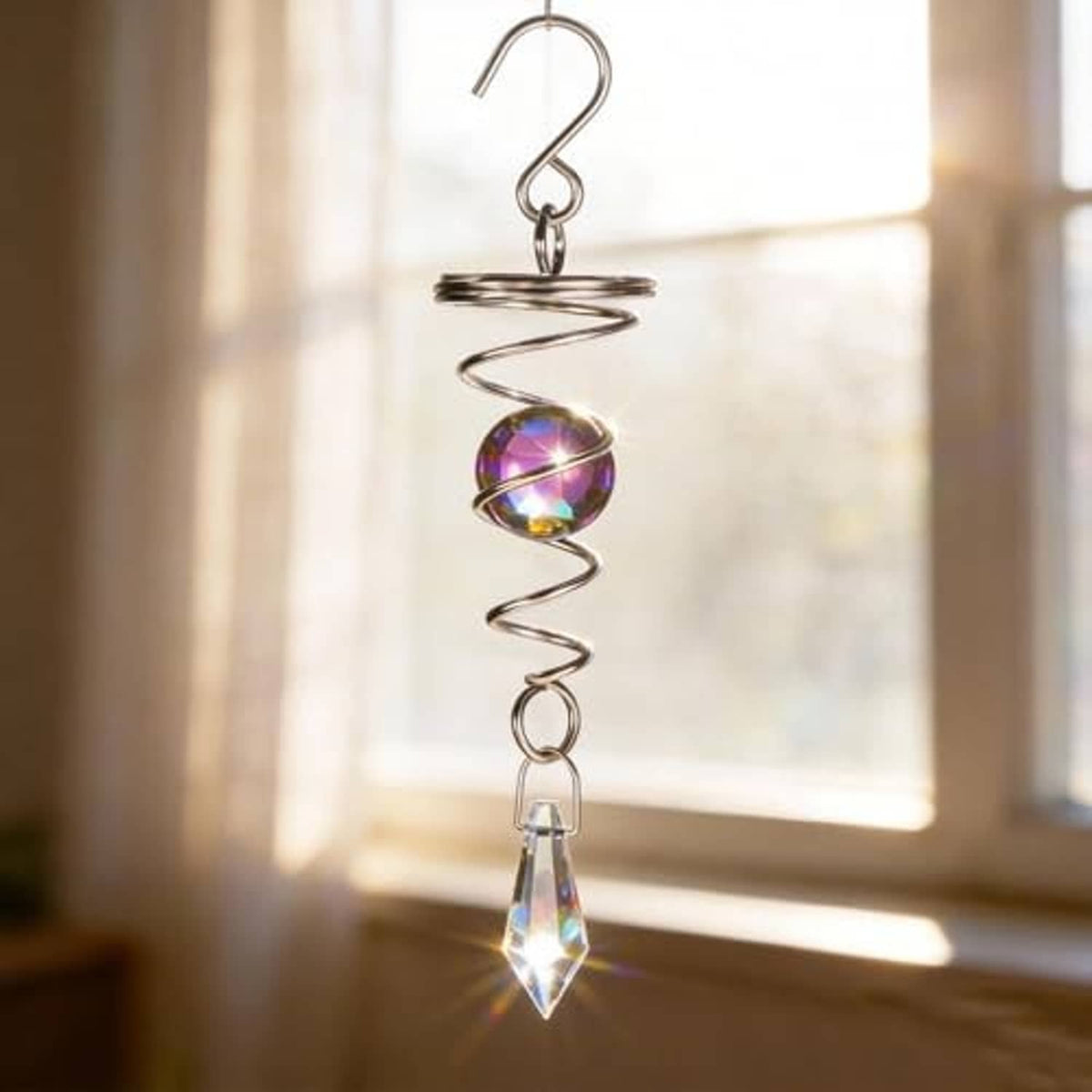 Stainless steel wind spinner with blue-purple iridescent sphere and clear crystal drop