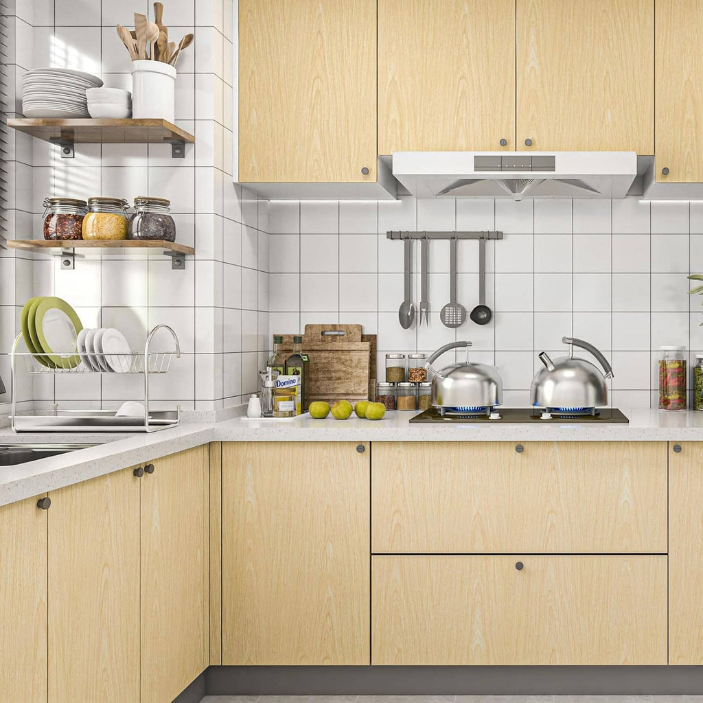Light wood grain contact paper covering kitchen cabinet doors and drawers