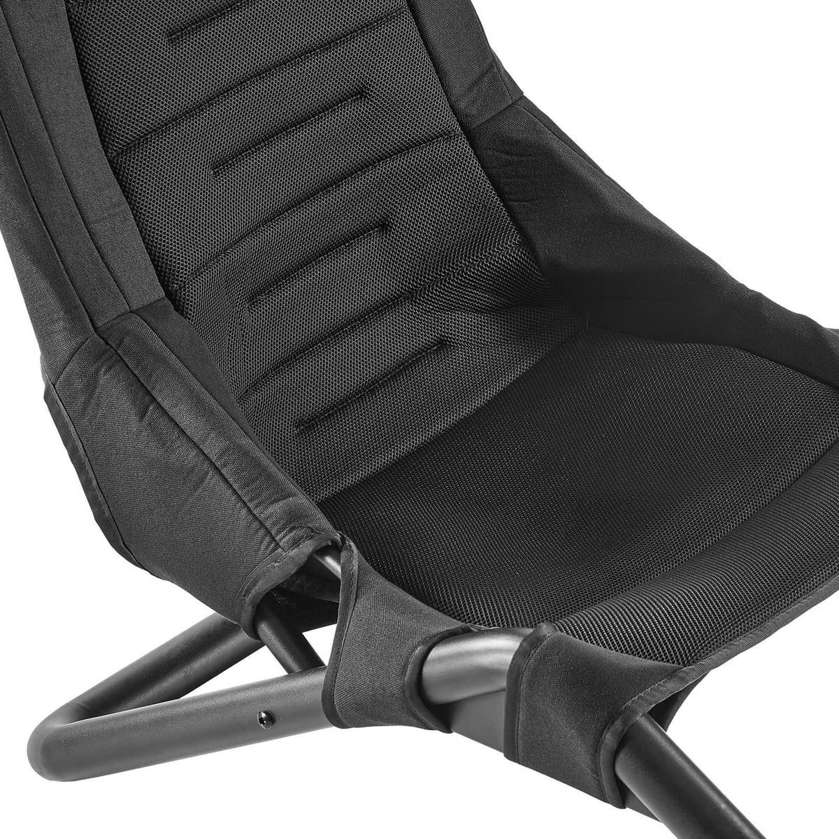 Racing seat and harness on steering wheel stand, black padded cushion and metal frame