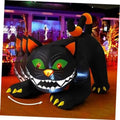 Inflatable black cat yard decoration with orange ears and glowing green eyes