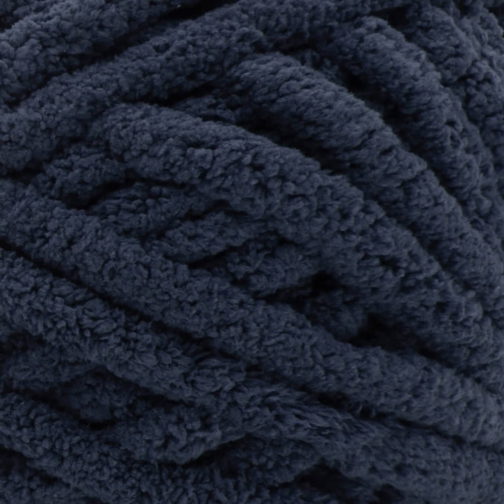 Dark indigo blue chenille yarn close-up with thick looped texture