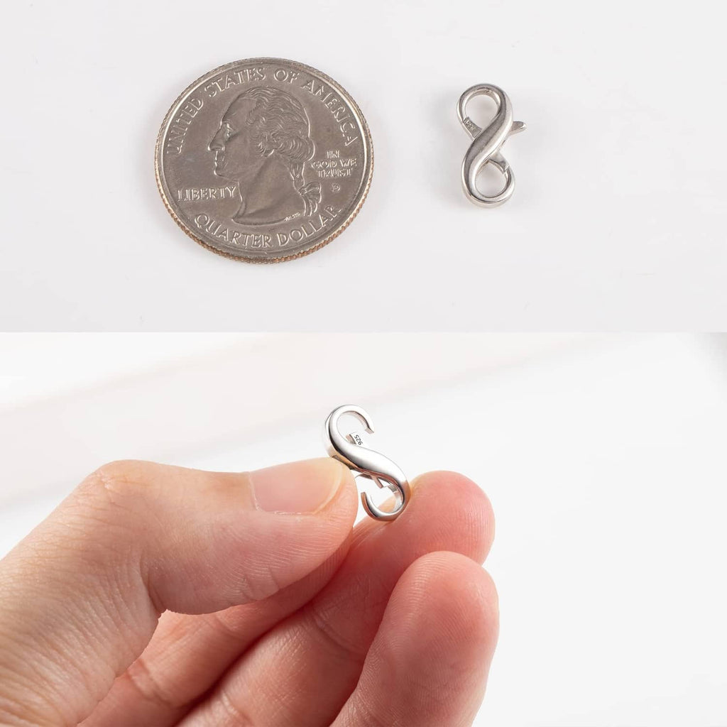 Sterling silver lobster clasp extender shown next to coin for scale