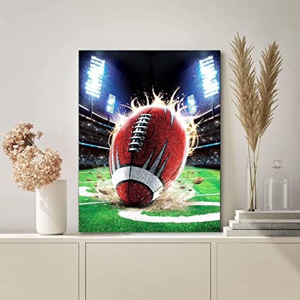 Framed football diamond painting artwork with red football, stadium lights, and green field