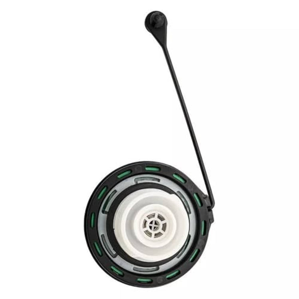 Diesel fuel cap underside with white vent insert, black housing, and green ring details