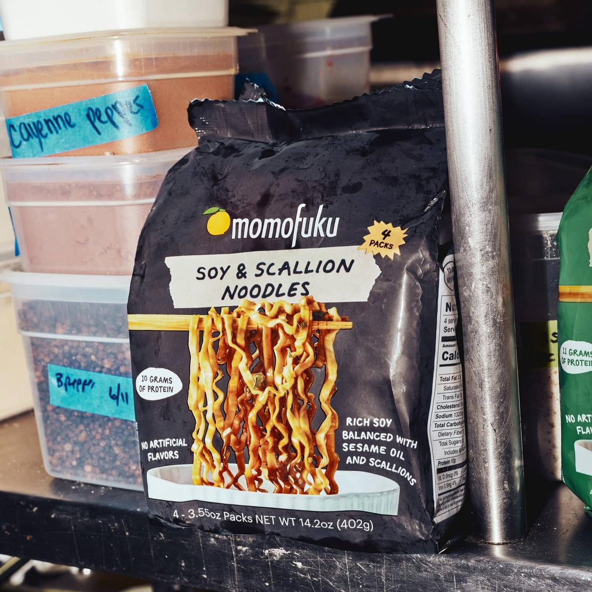 Soy and scallion ramen noodle packet with visible noodle strands inside