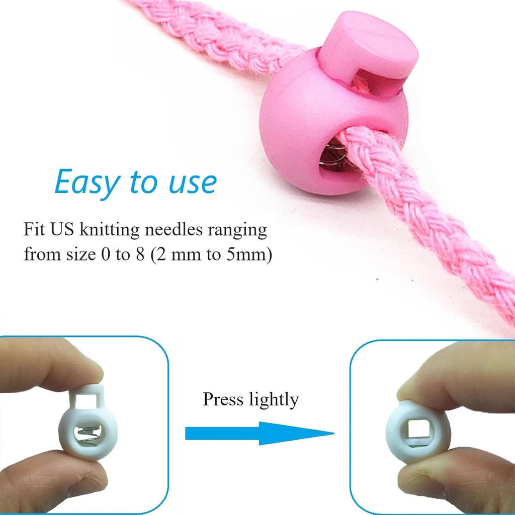 Pink plastic knitting needle stopper clipped to knitted yarn, showing spring interior.