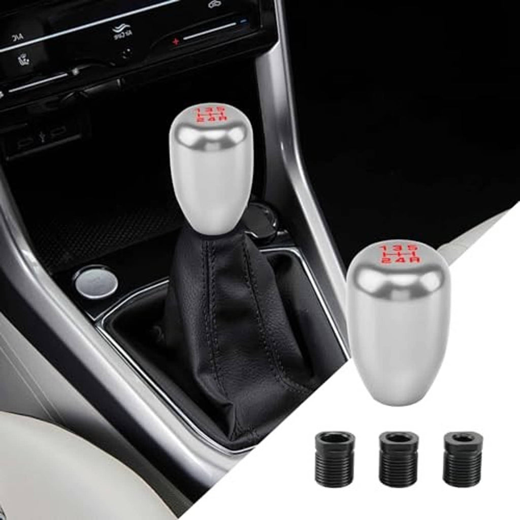 Silver manual car gear shift knob with black leather boot and 5-speed markings